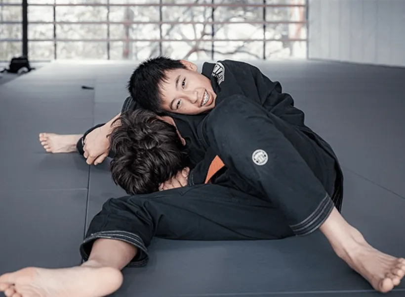 Equinox Academy's teenage students learning essential Brazilian Jiu-Jitsu (BJJ) techniques